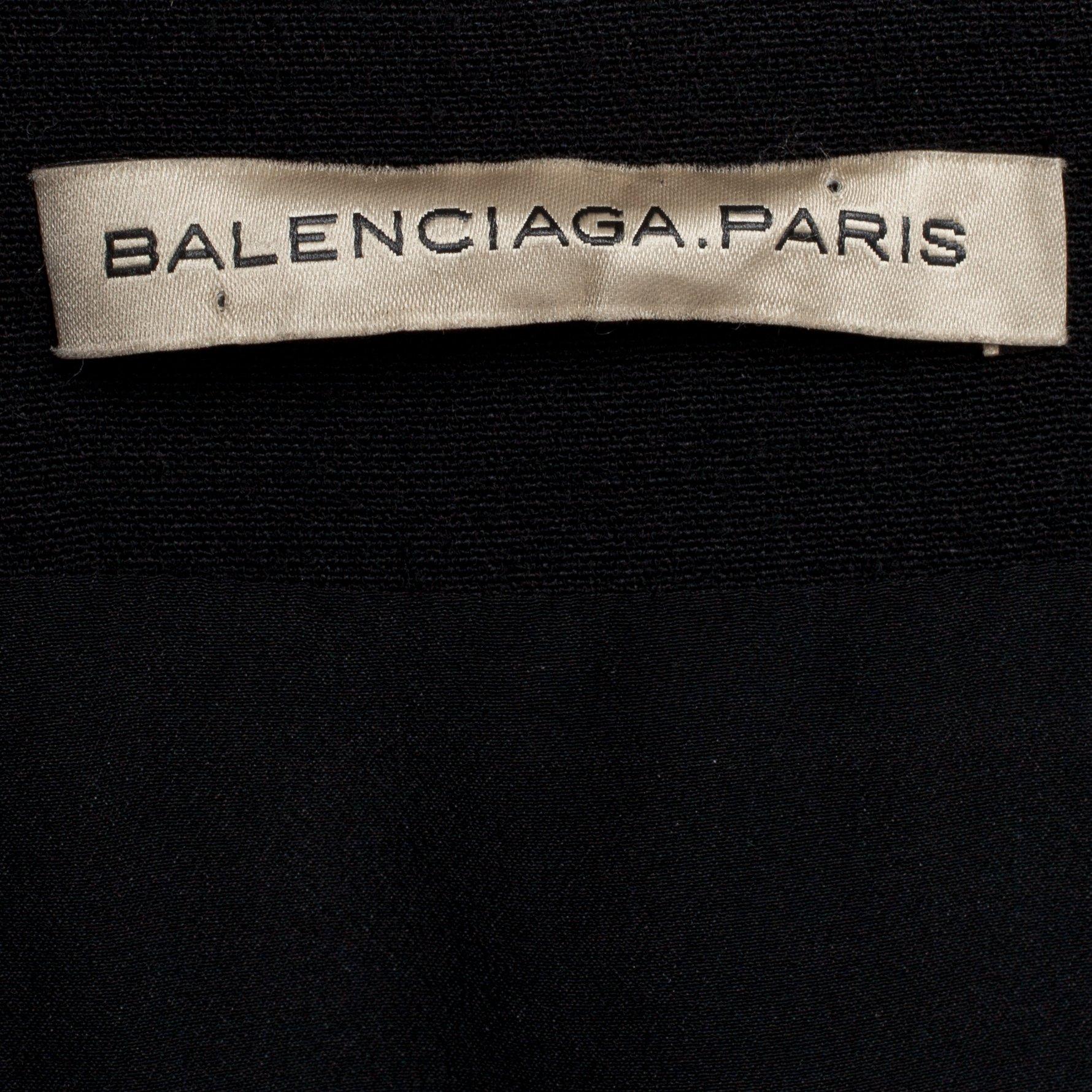 BALENCIAGA, a black wool blend and silk skirt.