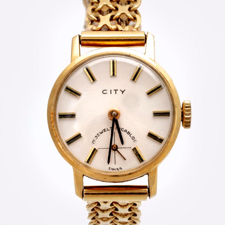 An 18K gold City wristwatch.