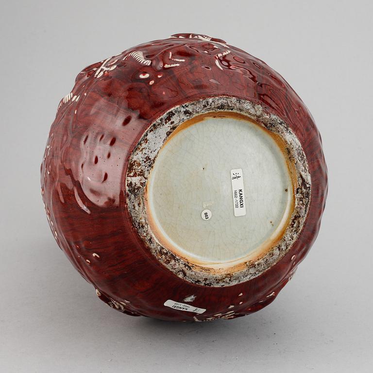 A red glazed Chinese vase, 20th century.