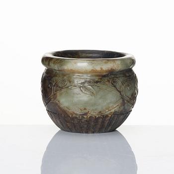 A well sculptured 'chrysanthemum' stone flowerpot, late Ming/early Qing dynasty.