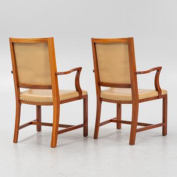 A par of stained beech wood armchairs, end of the 20th Century.