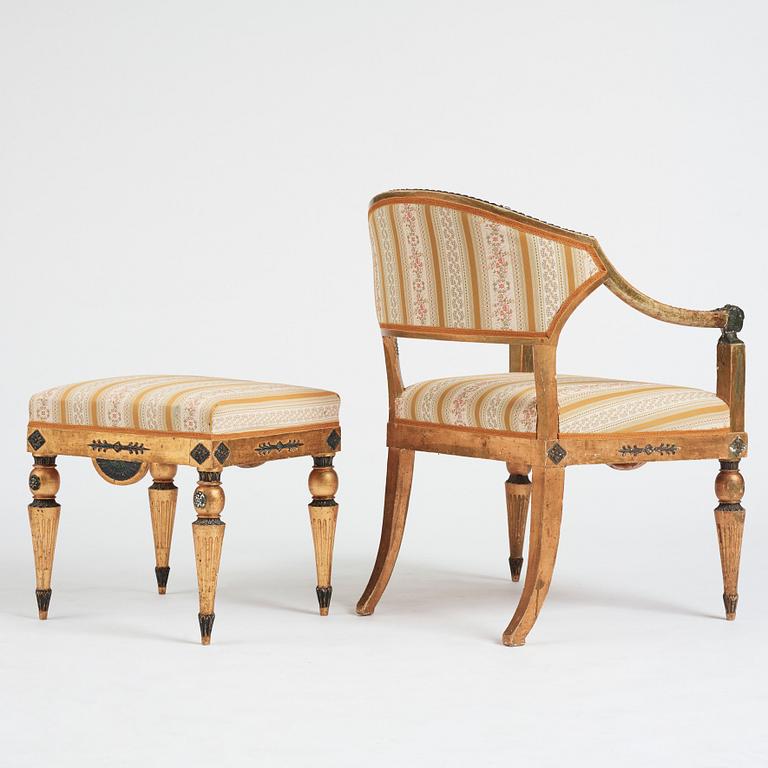 A Late gustavian armchair and stool in the manner of C G Gjörwll (1766-1837).