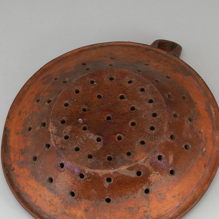 Two pottery strainers, 19th Century, Sweden.