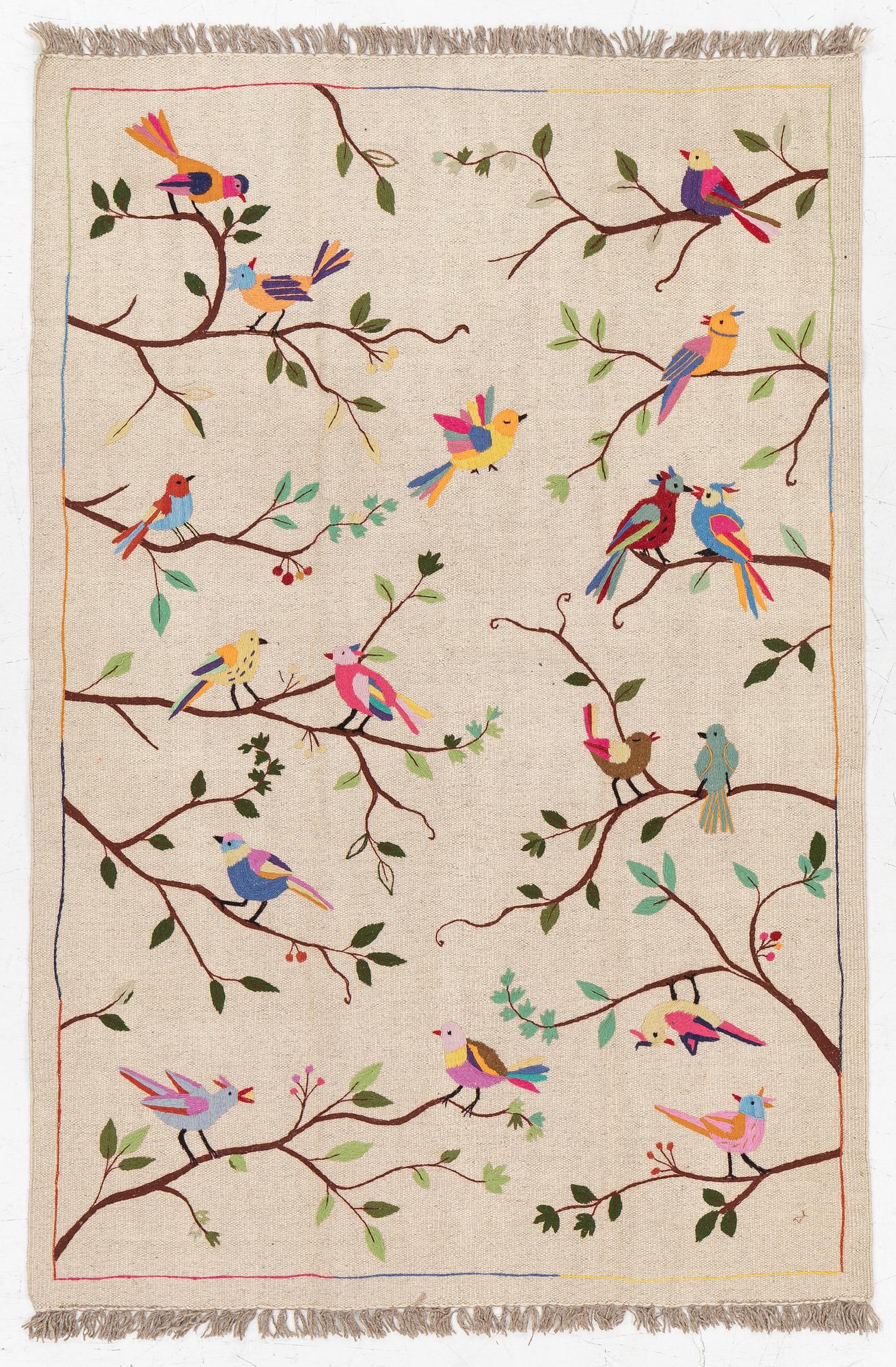 A hand-embroidered kelim rug, c. 183 x 125 cm.