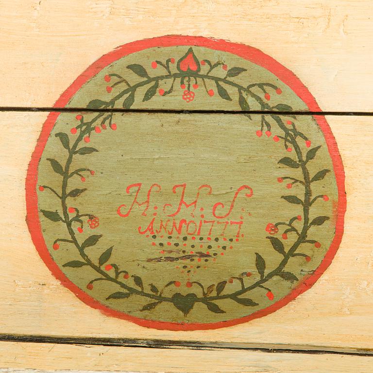 A wooden storage chest dated year 1777.