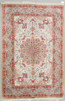 An oriental silk rug, possibly Qum, around 141 x 100 cm.