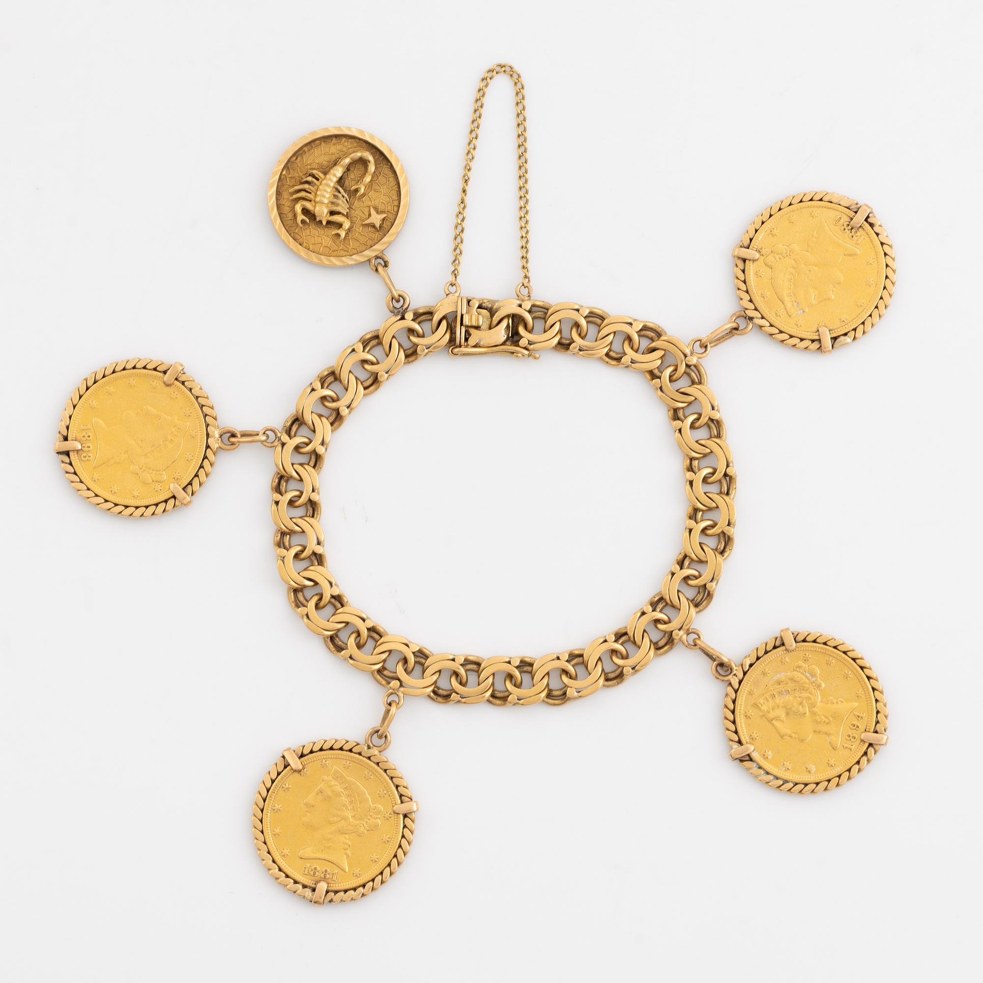 Armband guld bismarcklänk med berlocker med guldmynt.