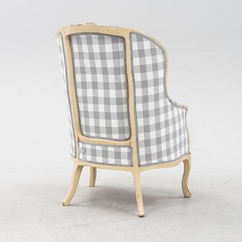 A Rococo-Style Bergère Easy Chair, first half of the 20th century.