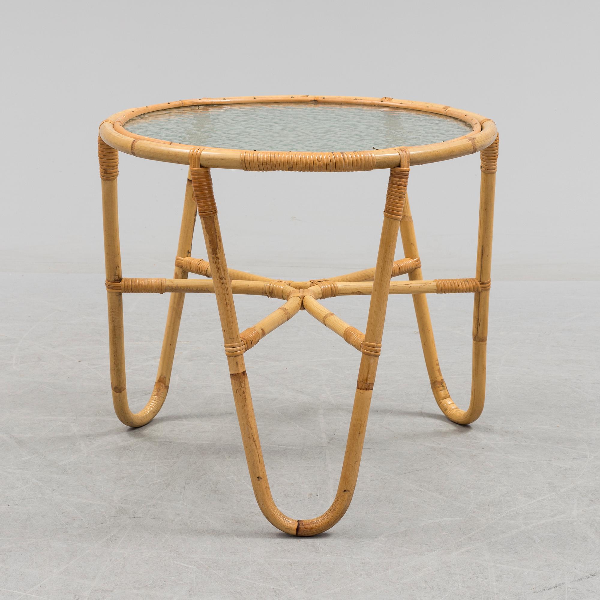 A second half of the 20th century sofa, table and armchairs.