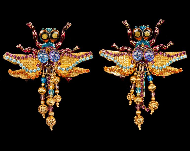 A pair of earrings in the shape of a dragon-fly by Lunch at the Ritz, USA.