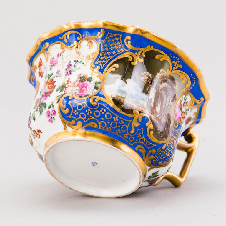 A Popov porcelain cup with saucer, Russia mid-19th Century.