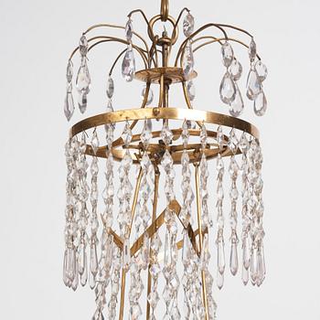 A late Gustavian gilt brass and cut glass seven-branch chandelier, Stockholm, late 18th century.