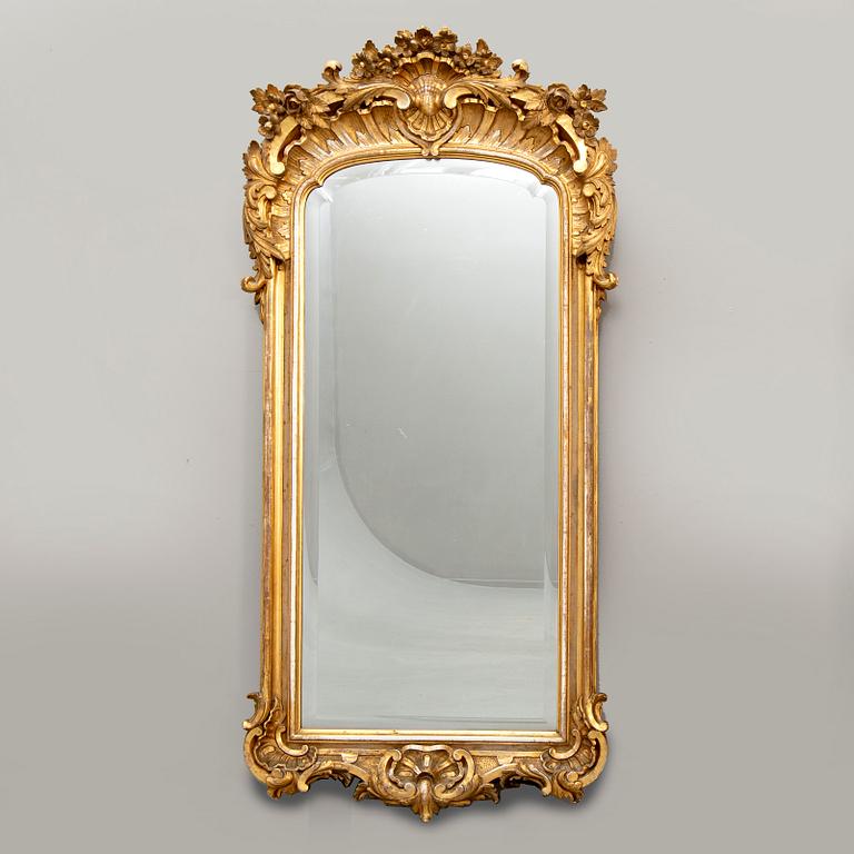 A Swedish Neo Rococo gilded signed mirror 1880s.