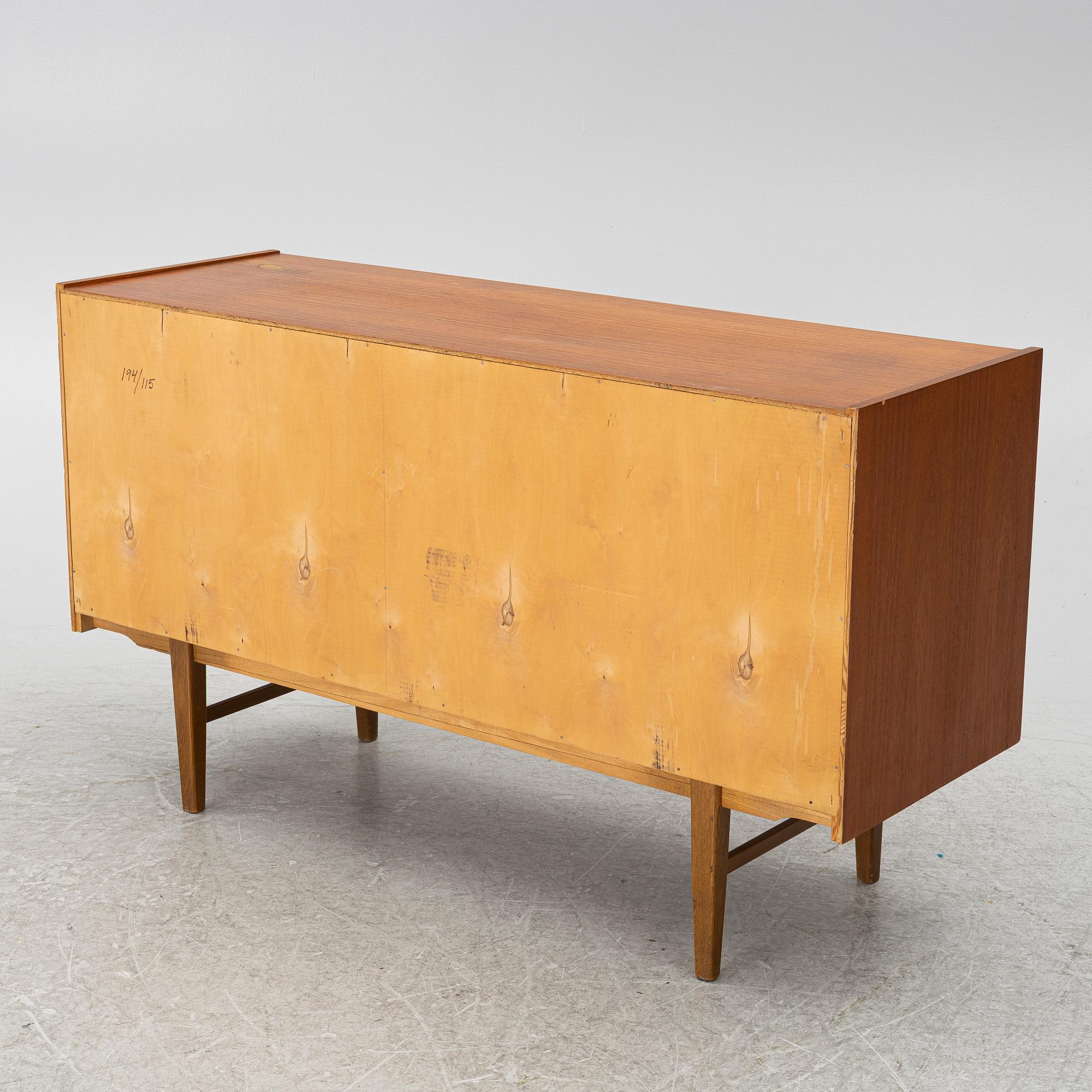 A 1950's teak veneered sideboard.