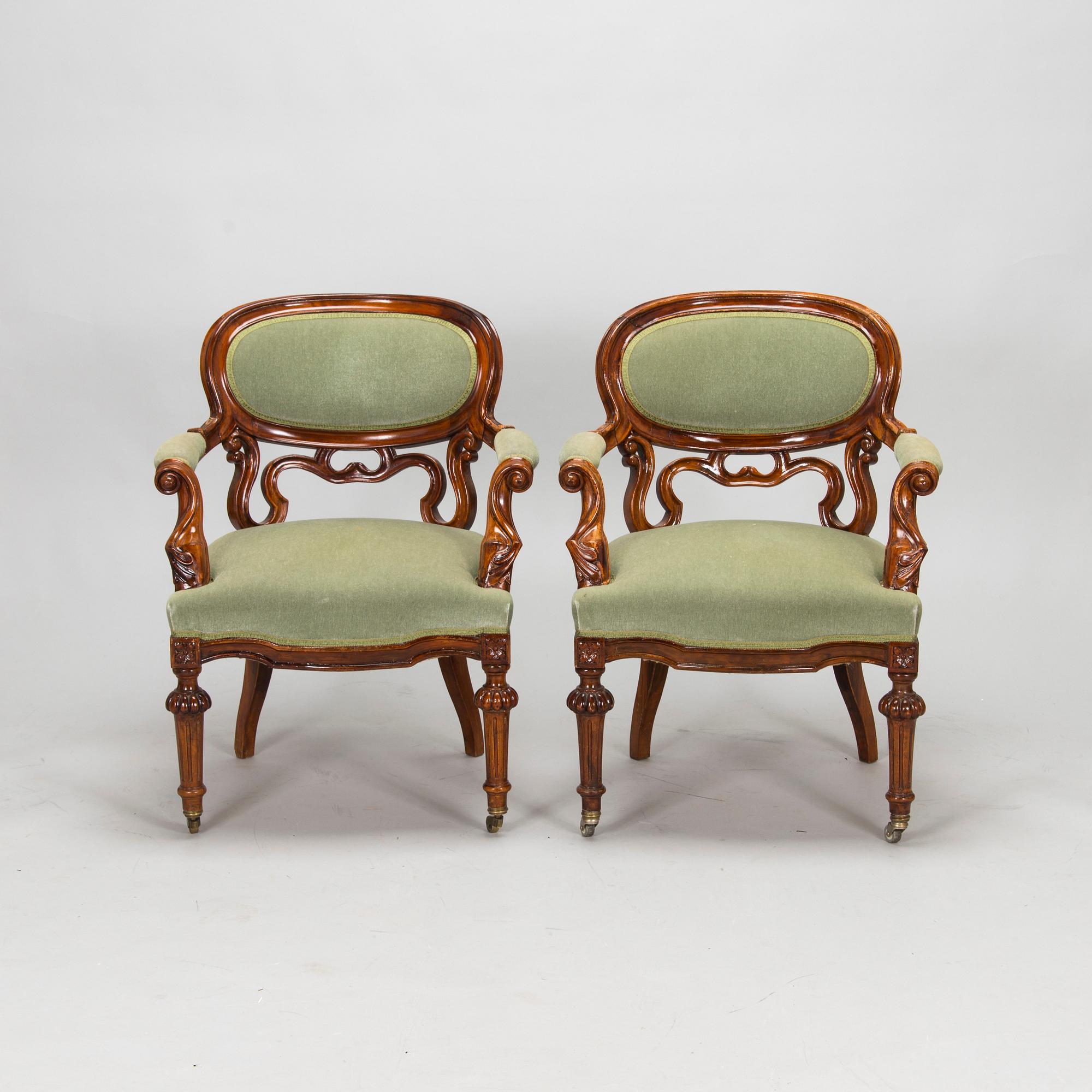 A pair of Russian armchairs and a table, late 19th century.