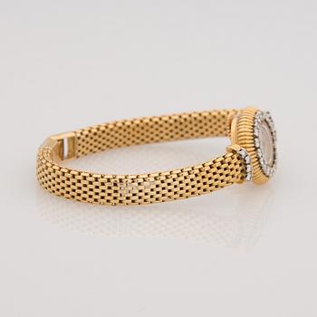 A WRISTWATCH, ladies Cartier, 18K gold, 28 pcs brilliant cut diamonds, totally c. 1,40 ct.