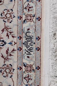 A carpet, Nain, part silk, ca 341 x 245 cm.