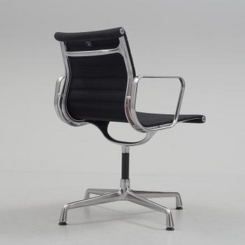 A 'EA 104 Swivel' armchair by Charles & Ray Eames, Vitra, 2016.