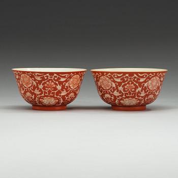 Two coral red ground bowls, late Qing dynasty, with Daoguang and Qianlong mark.