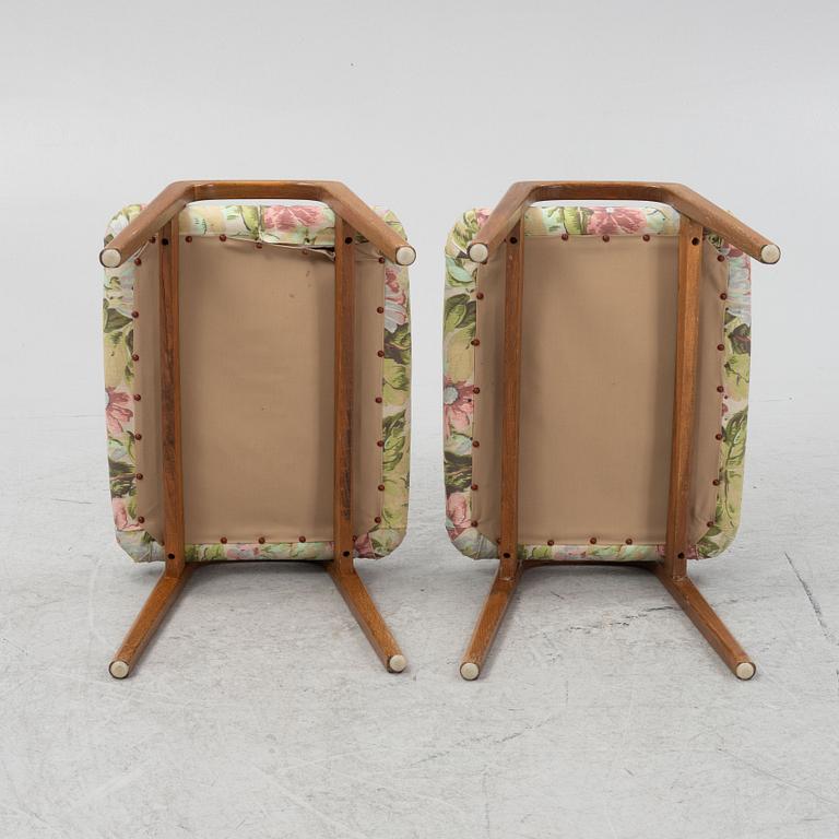 A pair of ottomans, 20th century.