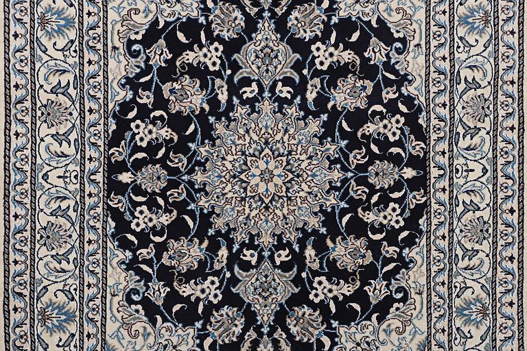 A rug, Nain, part silk, ca 198 x 144 cm.