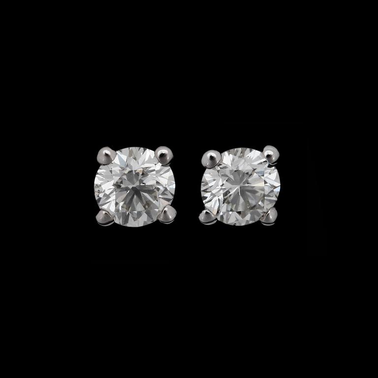 A pair of brilliant cut diamond earrings, 0.60 each.