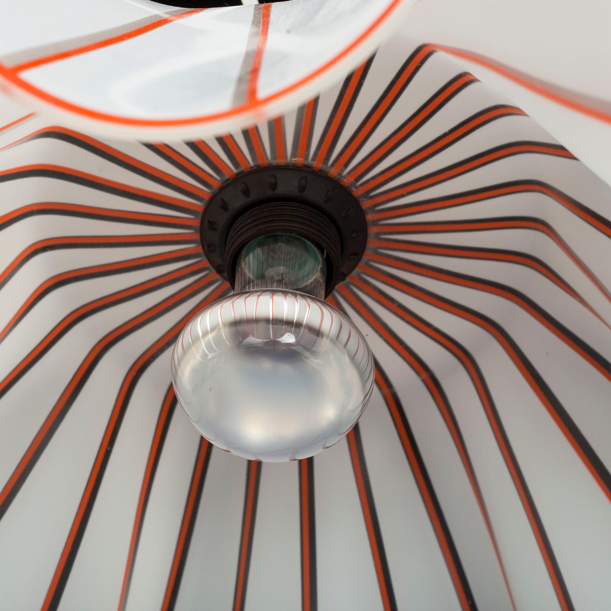A 1950s glass ceiling light.