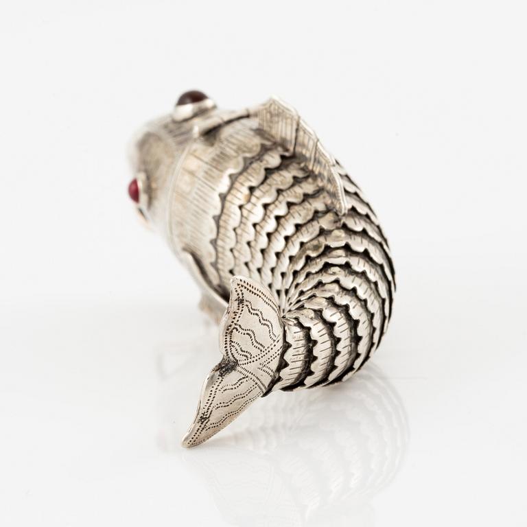 Pendant in the form of a fish, silver with red stones.