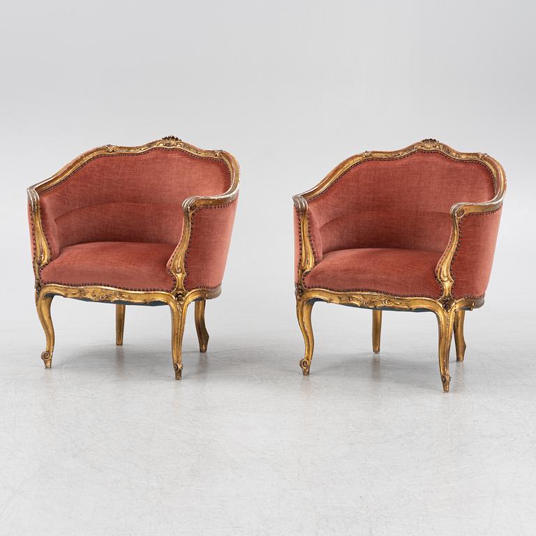 A pair of rococo style armchairs, around 1900.