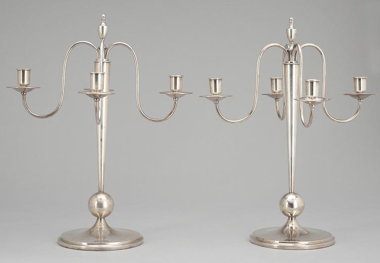 A pair of CG Hallberg silverplated candelabra.