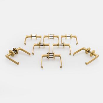 A set of eight 1960s-70s door handles.