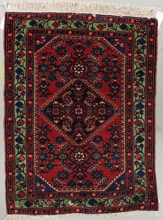 A west persian rug, around 76 x 58 cm.