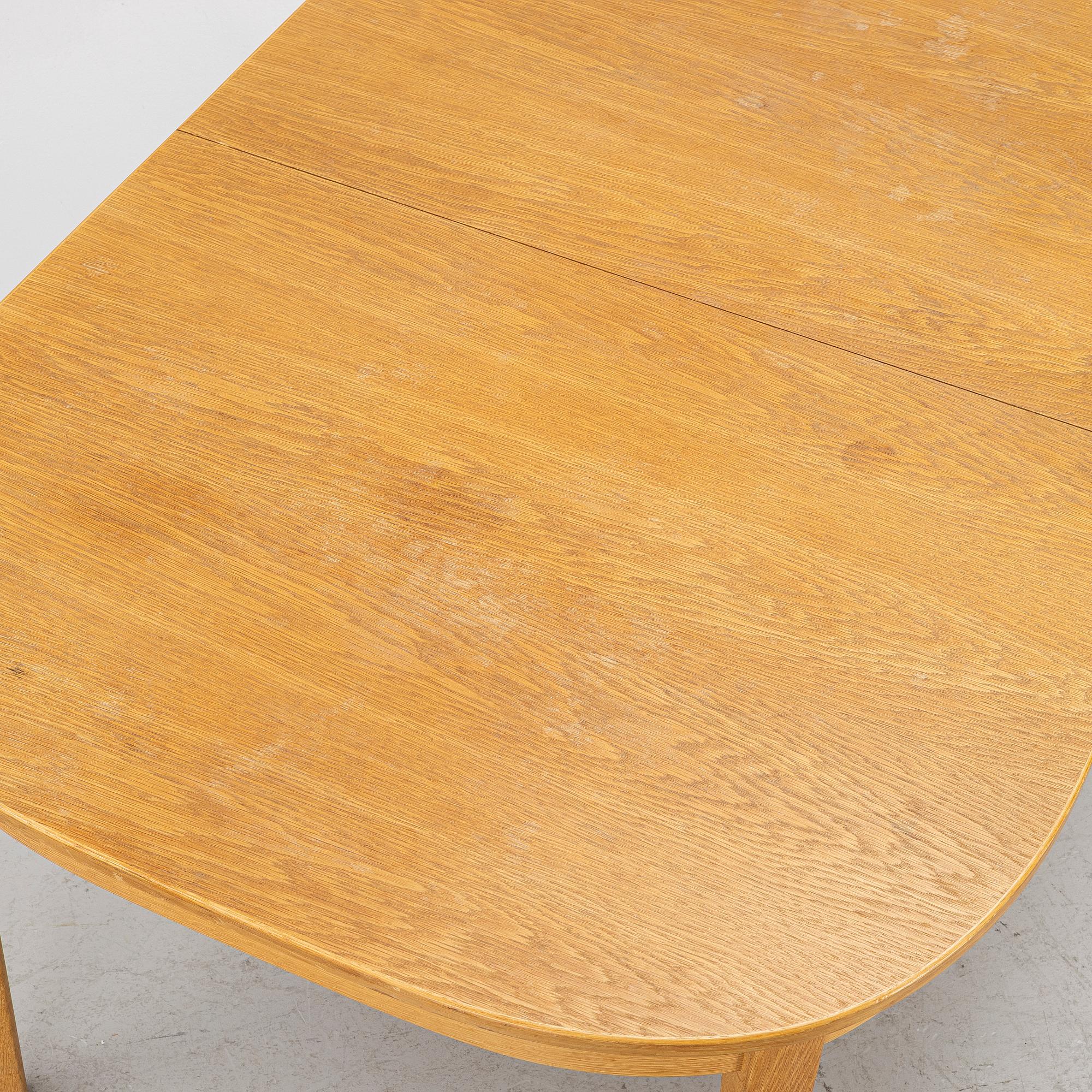 Carl Malmsten, Dining table with 6 chairs, “Ambassadör”, second half of the 20th century.