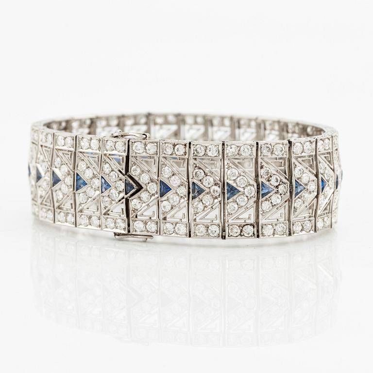 A platinum bracelet with old-cut diamonds and sapphires, likely Bucherer.