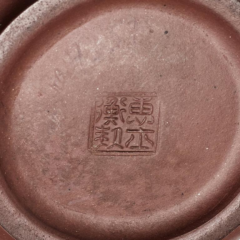 A yixing ware tea pot with cover, Qing dynasty, 18th Century.