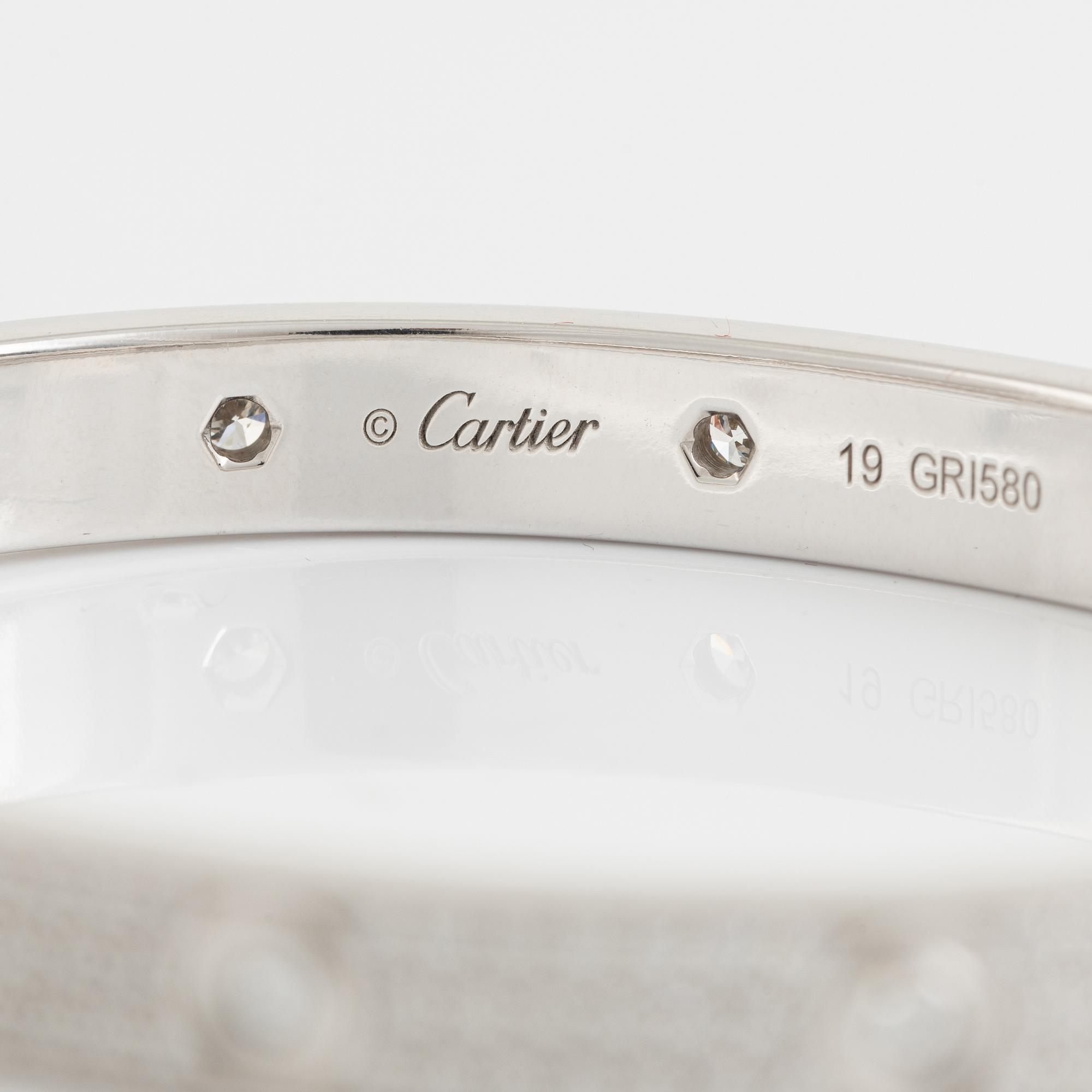 A Cartier "Love Pavé" in 18K white gold set with round brilliant-cut diamonds.