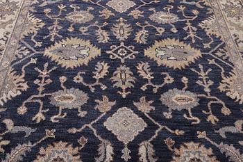 An oriental carpet of Mamluk design, c. 300 x 245 cm.