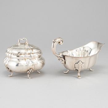 A rococo-style 20th century silver cream-jug and sugar-box, Swedish import marks.