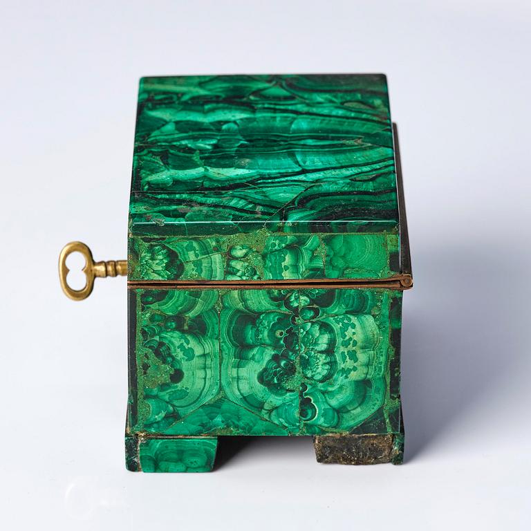 A Russian Nicolas II malachite-veneered box, circa 1900.