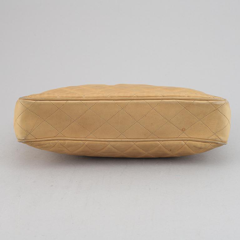 Chanel, a beige leather handbag, 1986-1988.