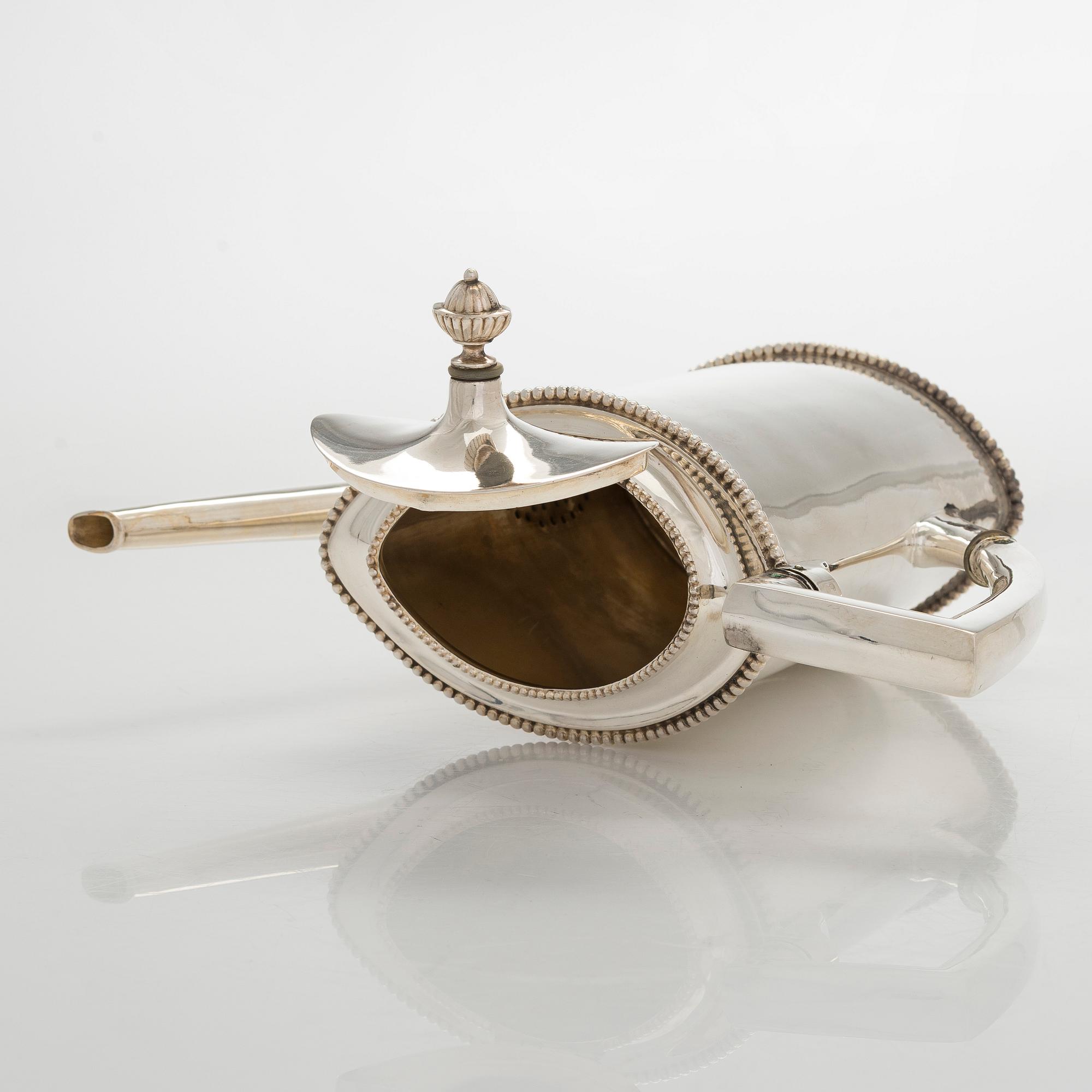 An early 20th century 4- piece sterling silver empire coffee set, C.G. Hallbergs Guldsmeds AB, Stockholm.