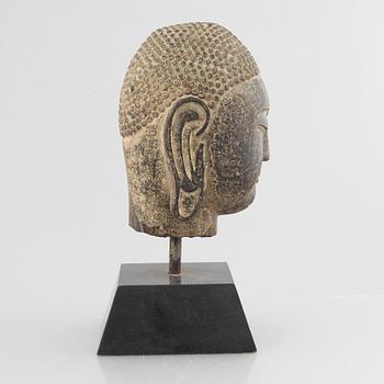 A Buddha's head, stone. Ming style.