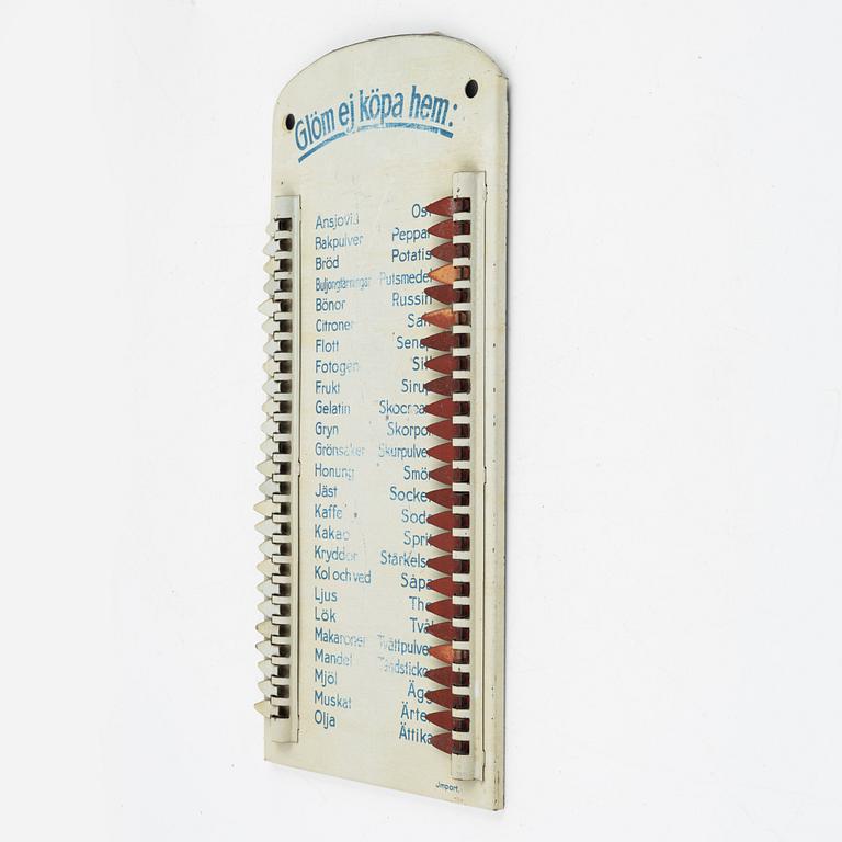 A metal shopping list, 1930's/40's.