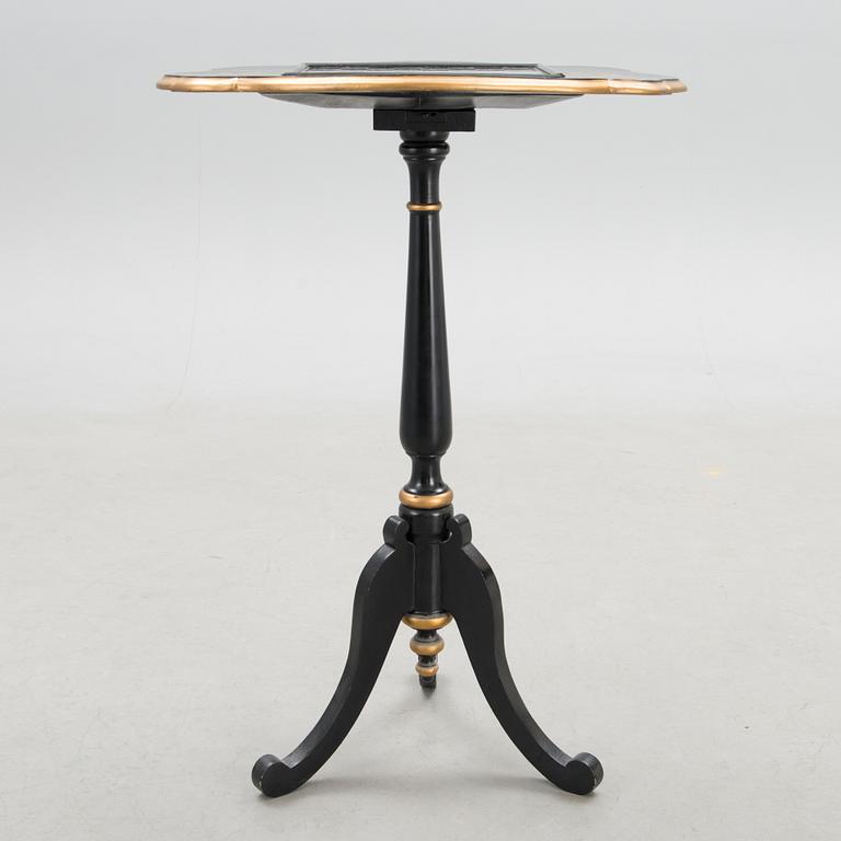 A Chinese tilt top chess table from the first half of the 20th century.