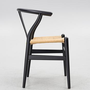 Hans J. Wegner, a model CH-24/'Wishbone' chair, Carl Hansen, Denmark, 21st century.