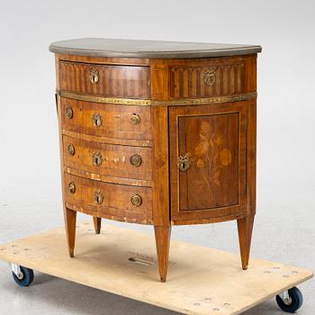 A Louis XVI style chest of drawers, 19th century.