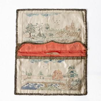 A silk embroidered wallet, dated 1773.