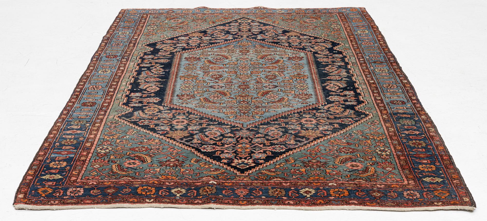 A carpet, semi-antique Hamadan, c. 199 x 128 cm.