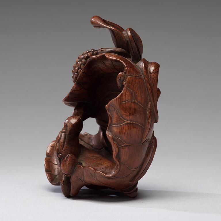 A bamboo carving of a crab and lotus, late Qing dynasty.