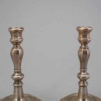 A pair of 18h century silver candlesticks, unidentified marks.